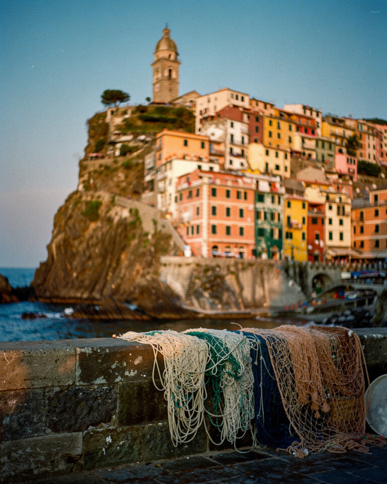 vernazza cinque terre golden hour: Multicolored cliffside houses of Vernazza, Cinque Terre, at golden hour with bell tower ca
